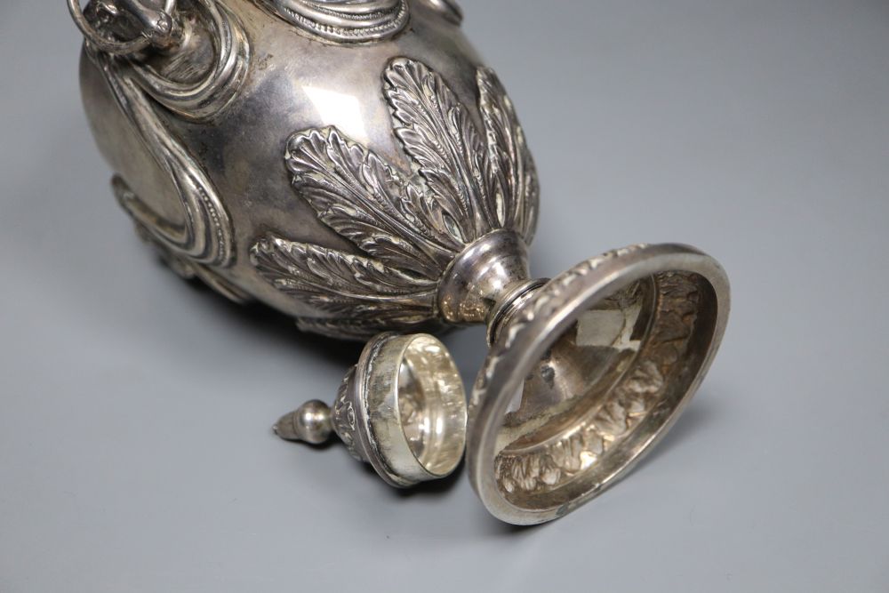 A George V silver vase and cover, with rams head and swag decoration and two ring handles, William Hutton & Sons, Sheffield, 1910,